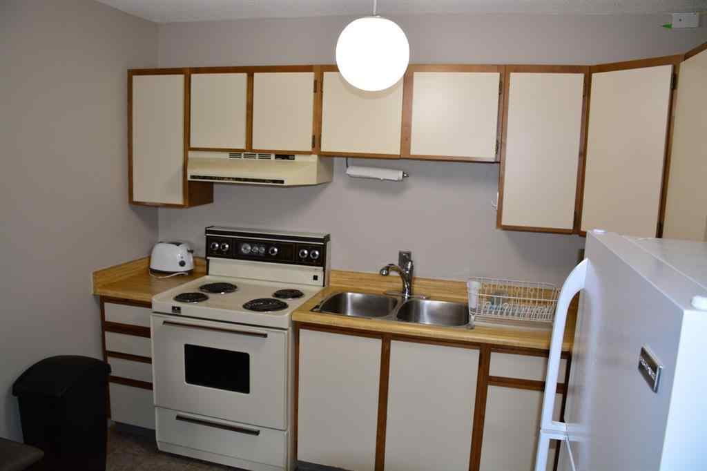 MLS® A2264118 - Unit #101-215 10118 100 Avenue  in Downtown Peace River, Multi-Family