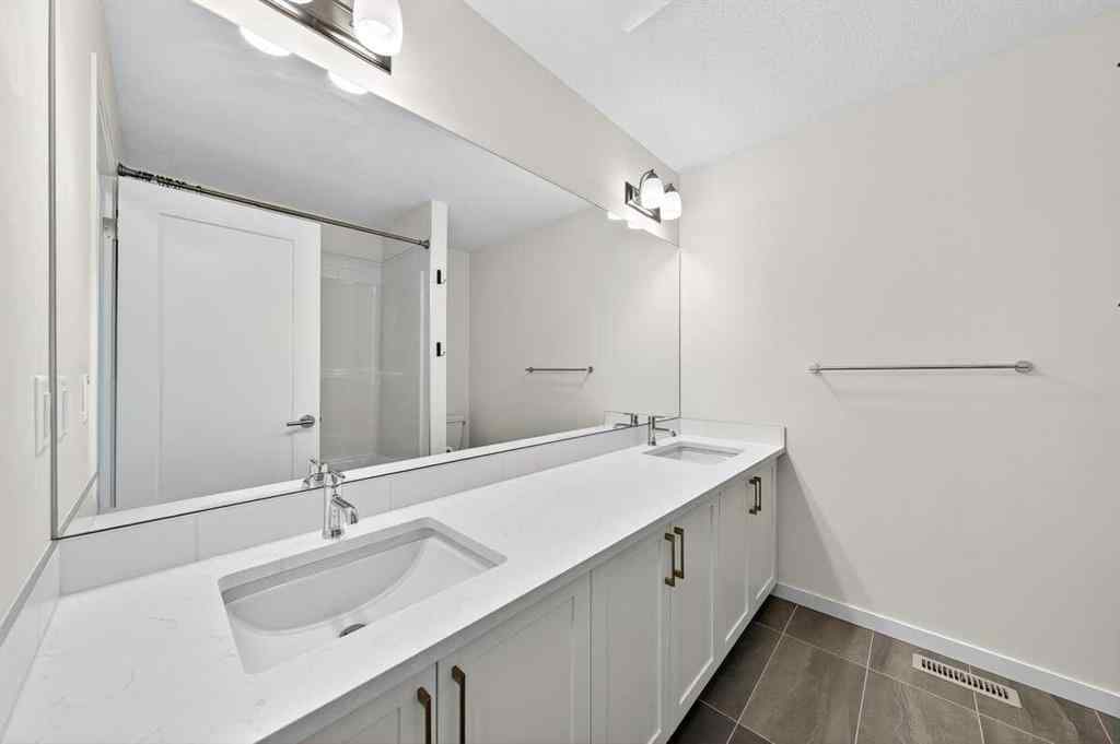 MLS® A2264158 - 675 South Point Heath SW in South Point Airdrie, Residential