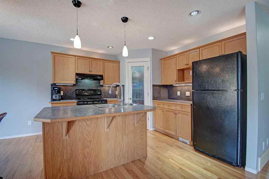 MLS® A2264160 - 209 Sagewood Place SW in Sagewood Airdrie, Residential