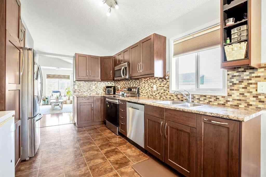 MLS® A2264218 - 273 Mt Allan Circle SE in McKenzie Lake Calgary, Residential