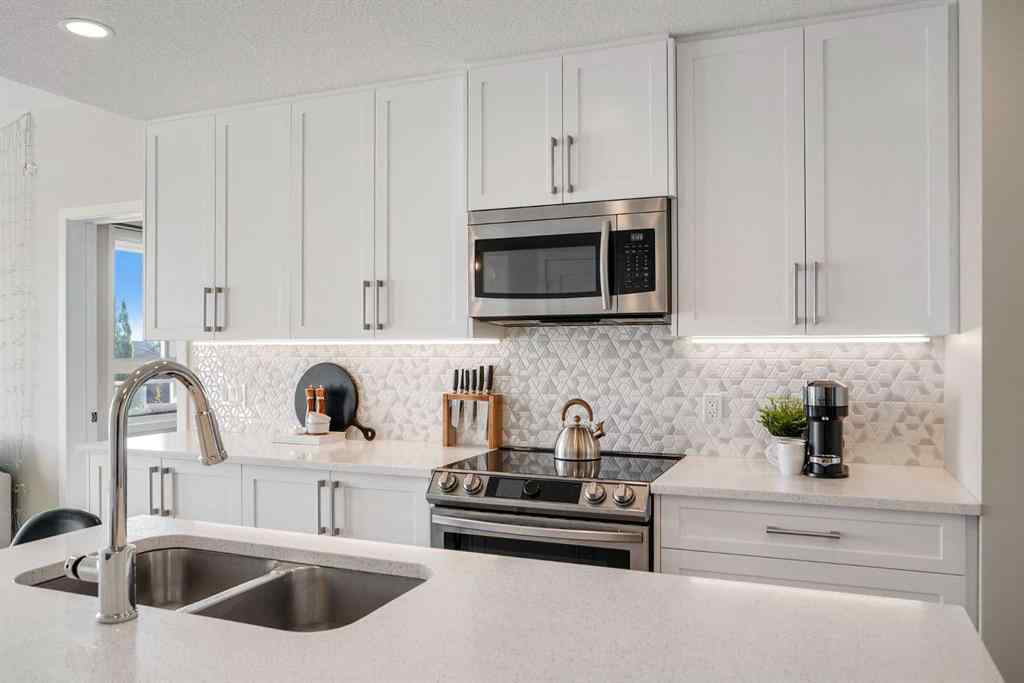 MLS® A2264265 - Unit #318 8530 8A Avenue SW in West Springs Calgary, Residential