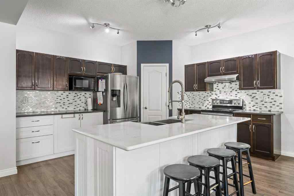 MLS® A2264302 - 303 Westmount Court  in Westridge Okotoks, Residential