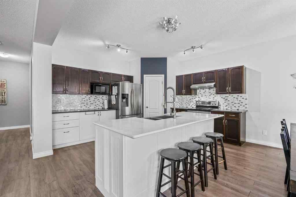 MLS® A2264302 - 303 Westmount Court  in Westridge Okotoks, Residential
