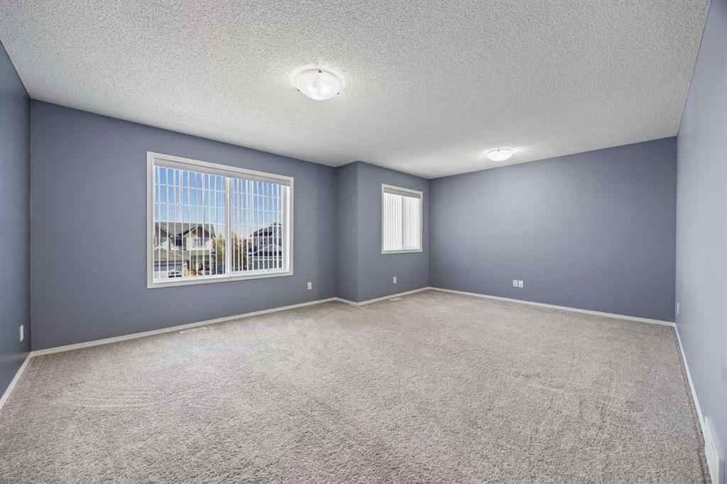 MLS® A2264302 - 303 Westmount Court  in Westridge Okotoks, Residential