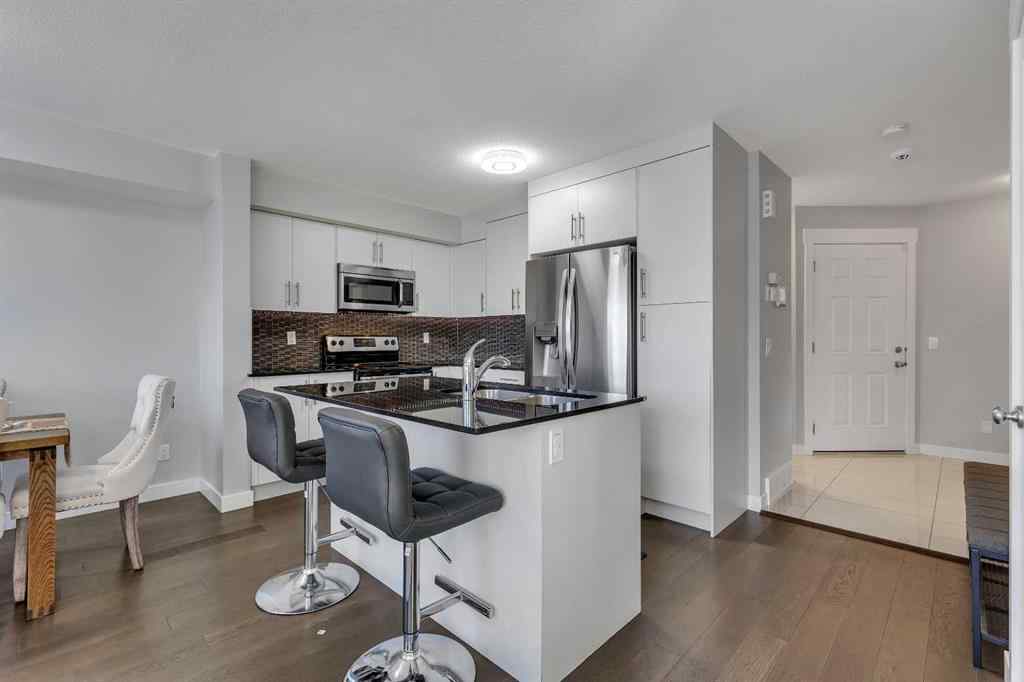 MLS® A2264462 - 7 West Coach Manor SW in West Springs Calgary, Residential