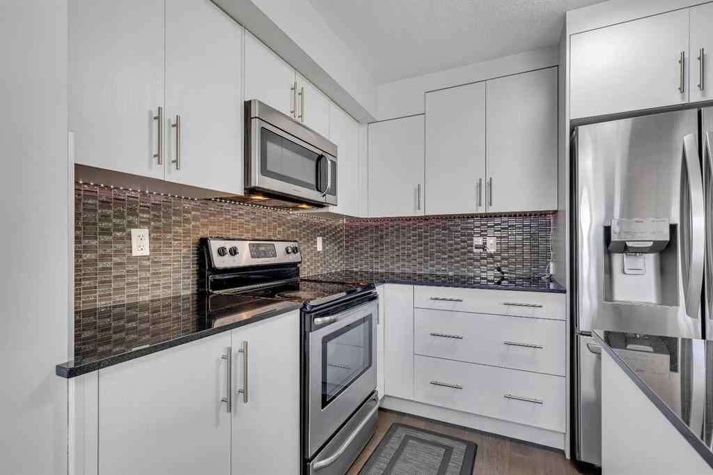 MLS® A2264462 - 7 West Coach Manor SW in West Springs Calgary, Residential