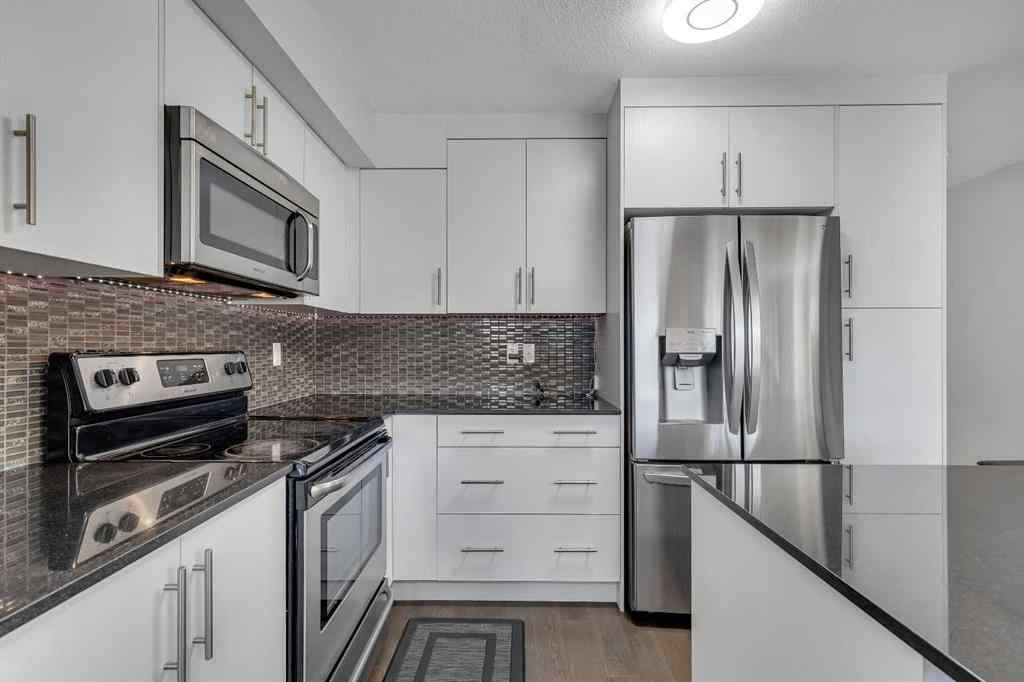 MLS® A2264462 - 7 West Coach Manor SW in West Springs Calgary, Residential