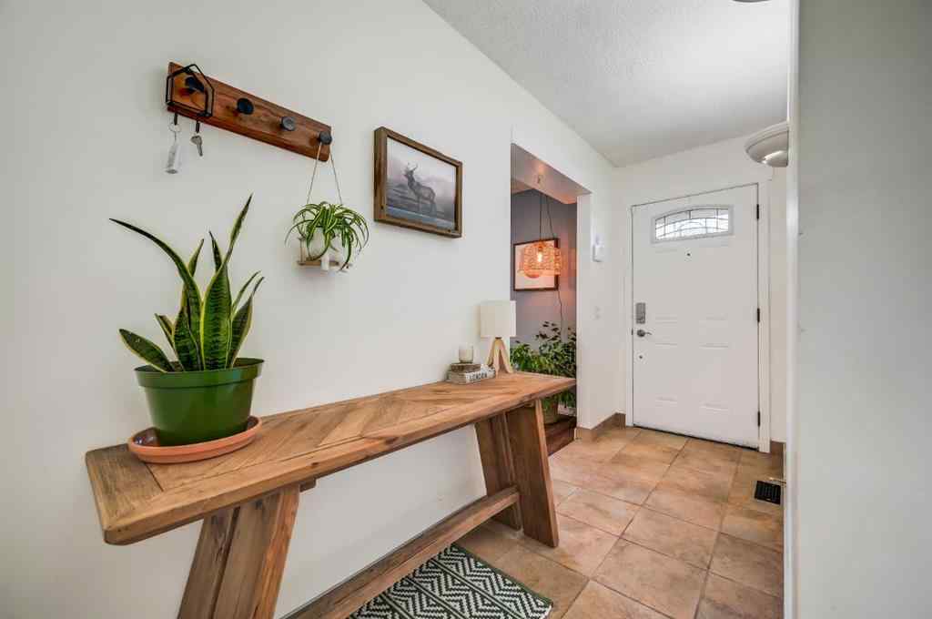 MLS® A2264693 - 828 Queensland Drive SE in Queensland Calgary, Residential