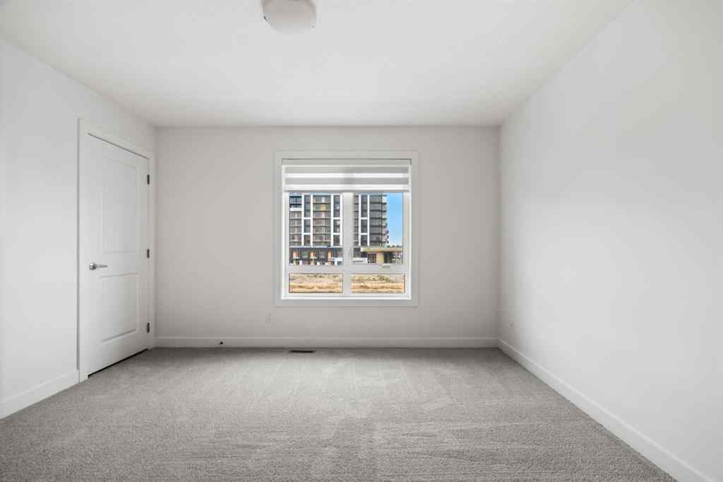 MLS® A2264976 - 8313 8 Avenue SW in West Springs Calgary, Residential