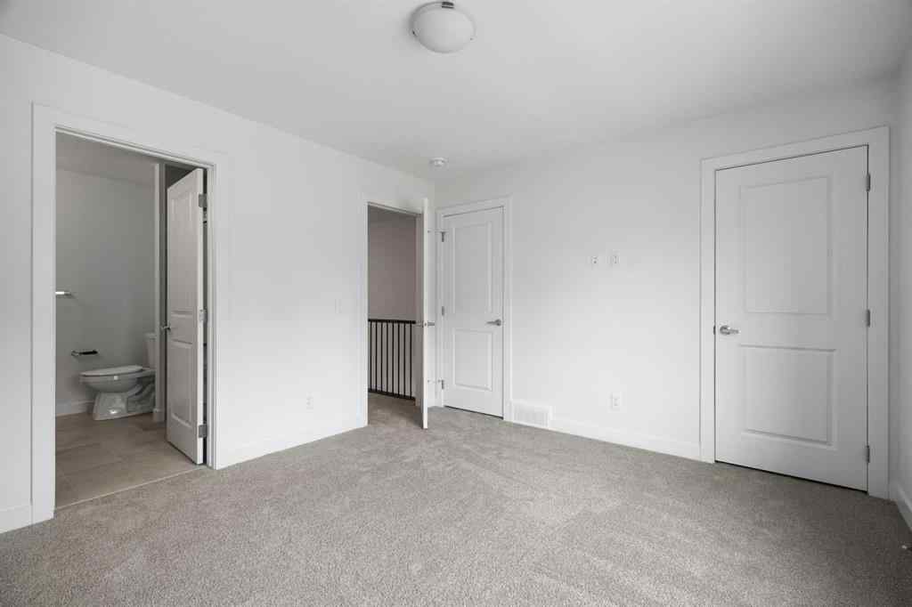 MLS® A2264976 - 8313 8 Avenue SW in West Springs Calgary, Residential