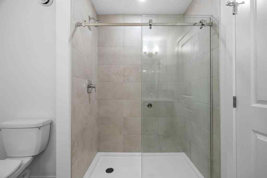 MLS® A2264976 - 8313 8 Avenue SW in West Springs Calgary, Residential