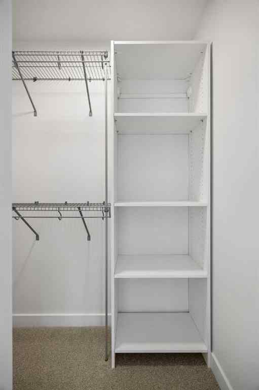 MLS® A2264976 - 8313 8 Avenue SW in West Springs Calgary, Residential