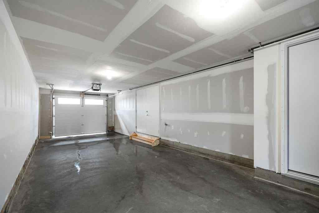 MLS® A2264976 - 8313 8 Avenue SW in West Springs Calgary, Residential