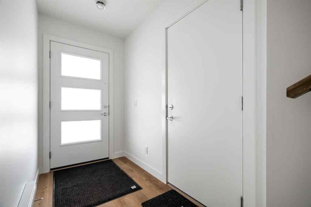 MLS® A2264976 - 8313 8 Avenue SW in West Springs Calgary, Residential