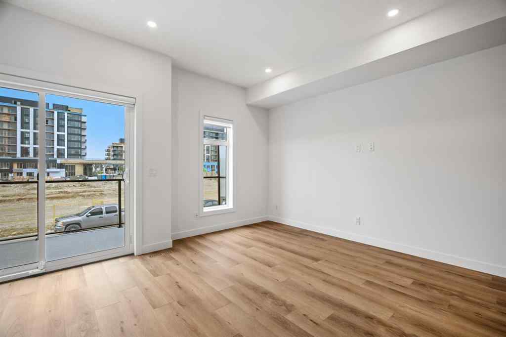 MLS® A2264976 - 8313 8 Avenue SW in West Springs Calgary, Residential