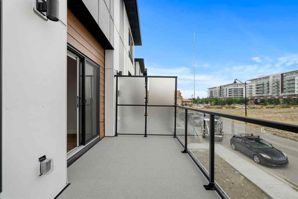 MLS® A2264976 - 8313 8 Avenue SW in West Springs Calgary, Residential
