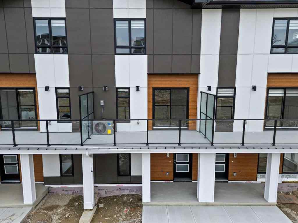 MLS® A2264976 - 8313 8 Avenue SW in West Springs Calgary, Residential