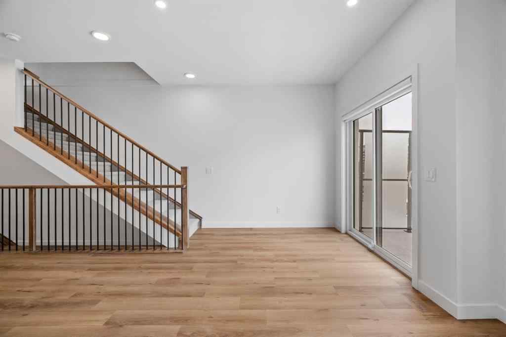 MLS® A2264976 - 8313 8 Avenue SW in West Springs Calgary, Residential