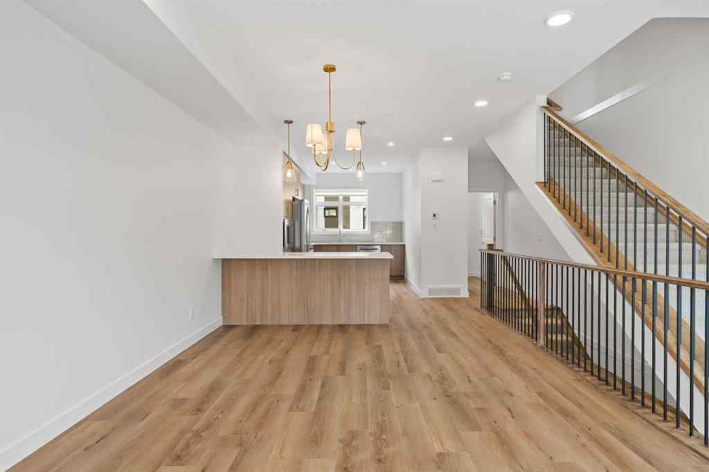 MLS® A2264976 - 8313 8 Avenue SW in West Springs Calgary, Residential