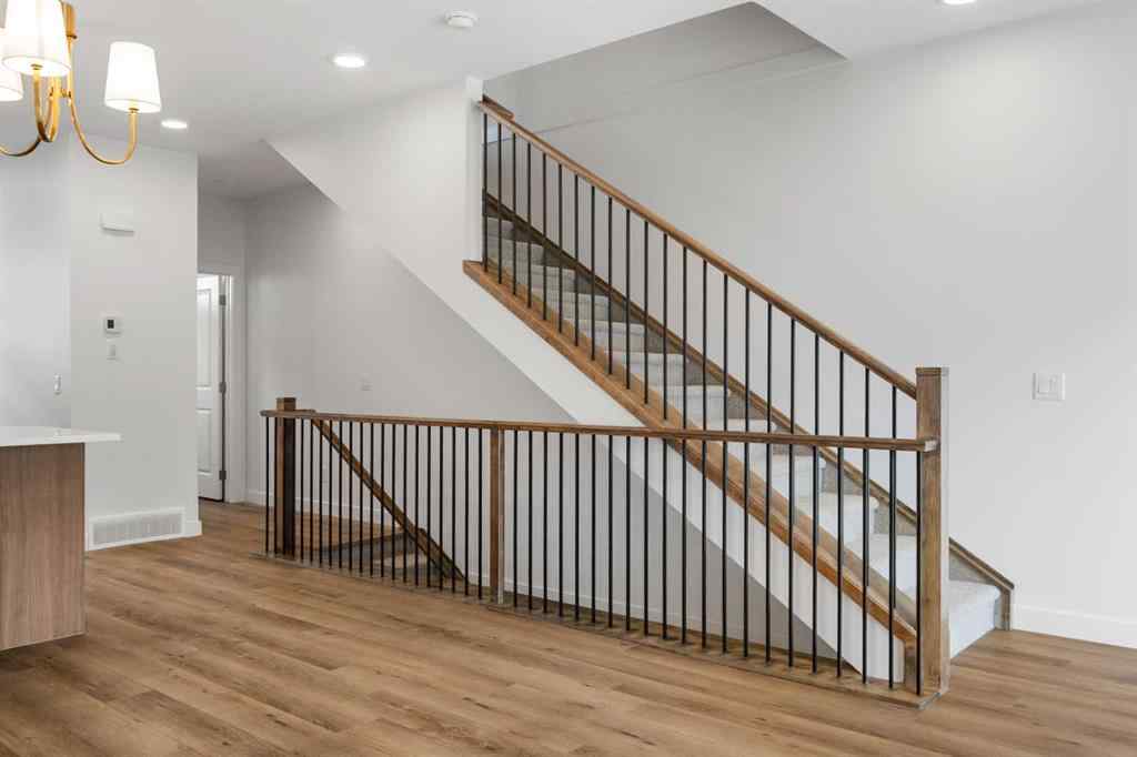 MLS® A2264976 - 8313 8 Avenue SW in West Springs Calgary, Residential