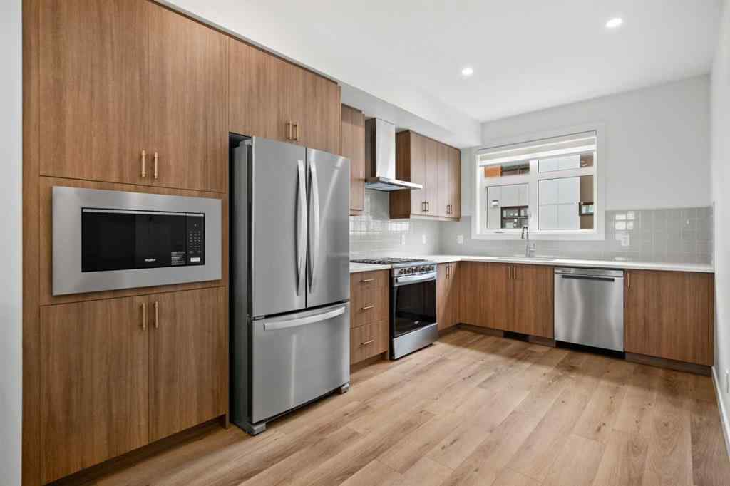 MLS® A2264976 - 8313 8 Avenue SW in West Springs Calgary, Residential