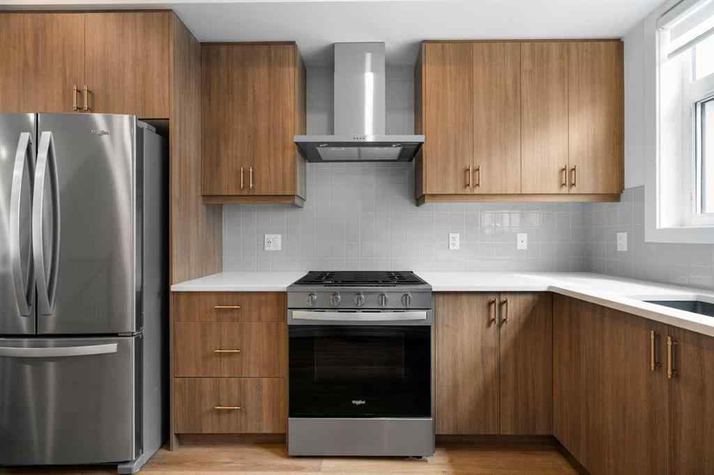 MLS® A2264976 - 8313 8 Avenue SW in West Springs Calgary, Residential