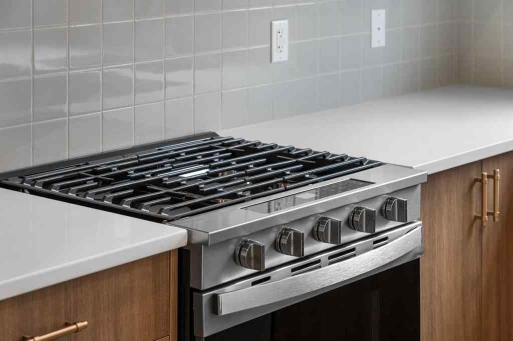 MLS® A2264976 - 8313 8 Avenue SW in West Springs Calgary, Residential