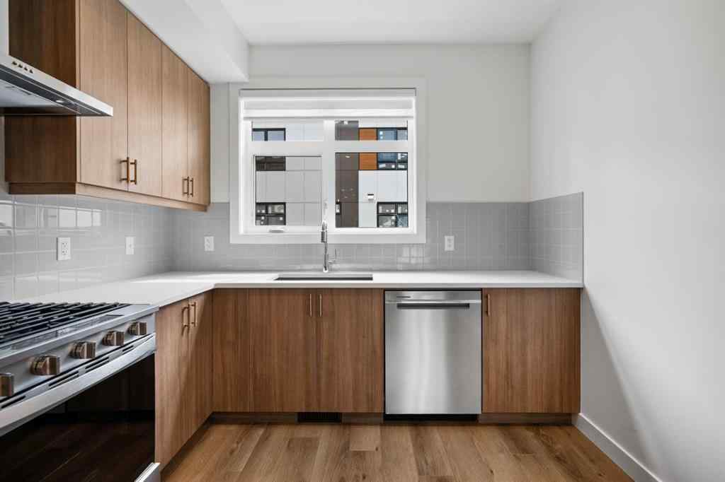 MLS® A2264976 - 8313 8 Avenue SW in West Springs Calgary, Residential