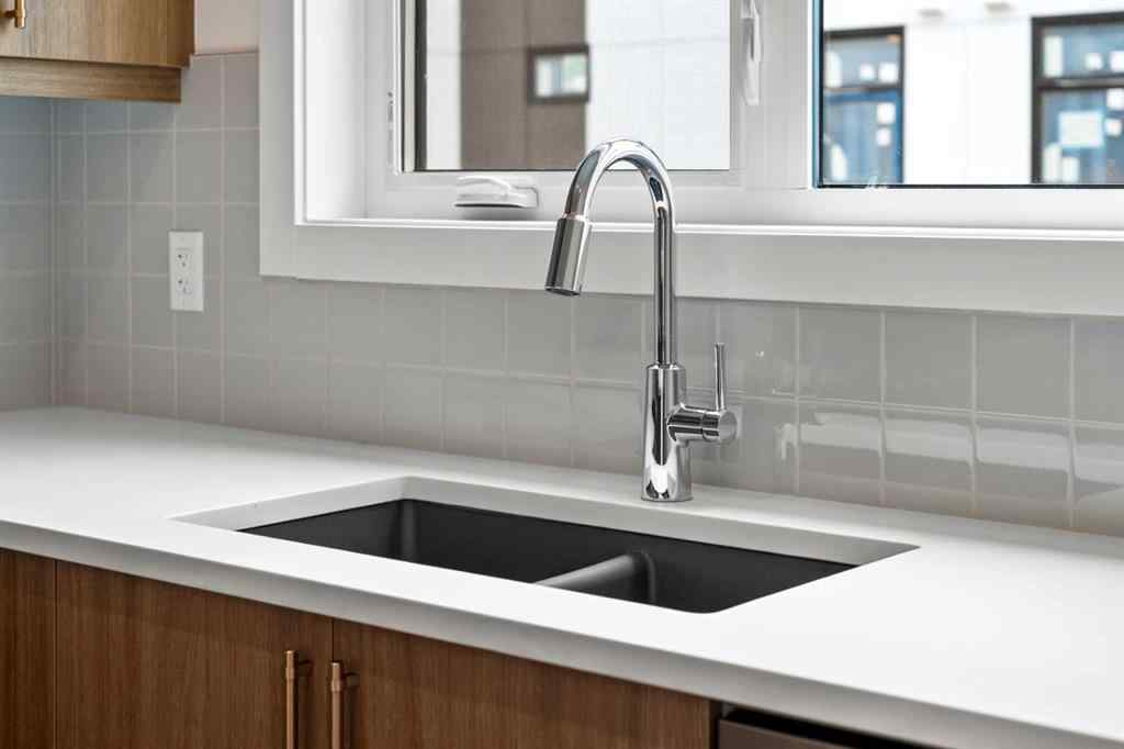 MLS® A2264976 - 8313 8 Avenue SW in West Springs Calgary, Residential