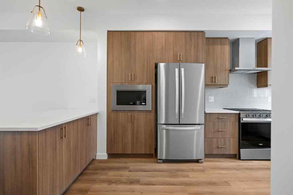 MLS® A2264976 - 8313 8 Avenue SW in West Springs Calgary, Residential