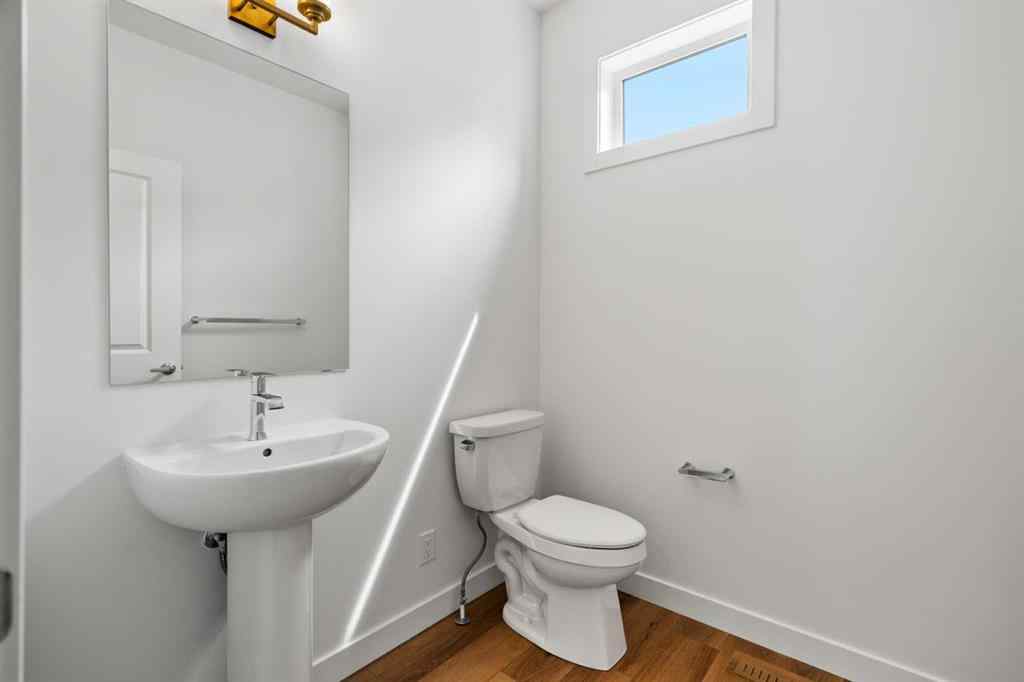 MLS® A2264976 - 8313 8 Avenue SW in West Springs Calgary, Residential