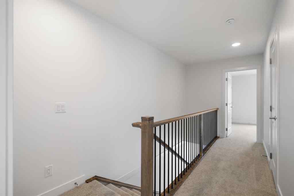 MLS® A2264976 - 8313 8 Avenue SW in West Springs Calgary, Residential