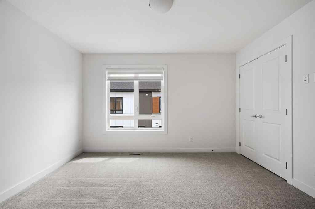 MLS® A2264976 - 8313 8 Avenue SW in West Springs Calgary, Residential