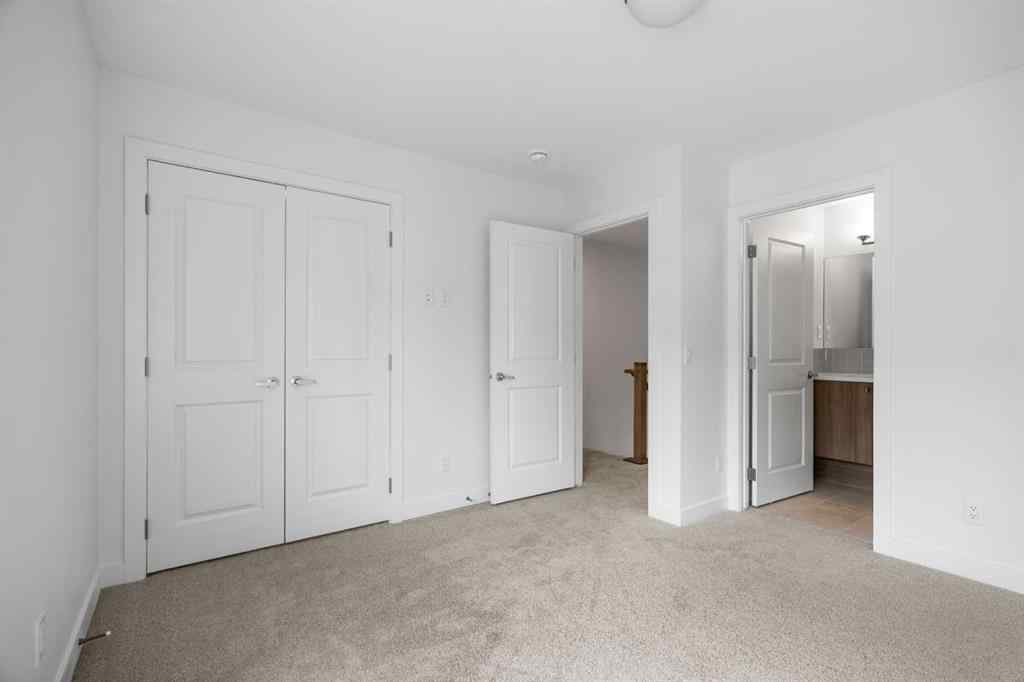 MLS® A2264976 - 8313 8 Avenue SW in West Springs Calgary, Residential