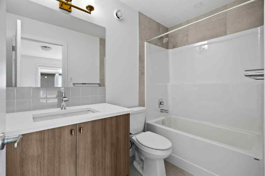 MLS® A2264976 - 8313 8 Avenue SW in West Springs Calgary, Residential