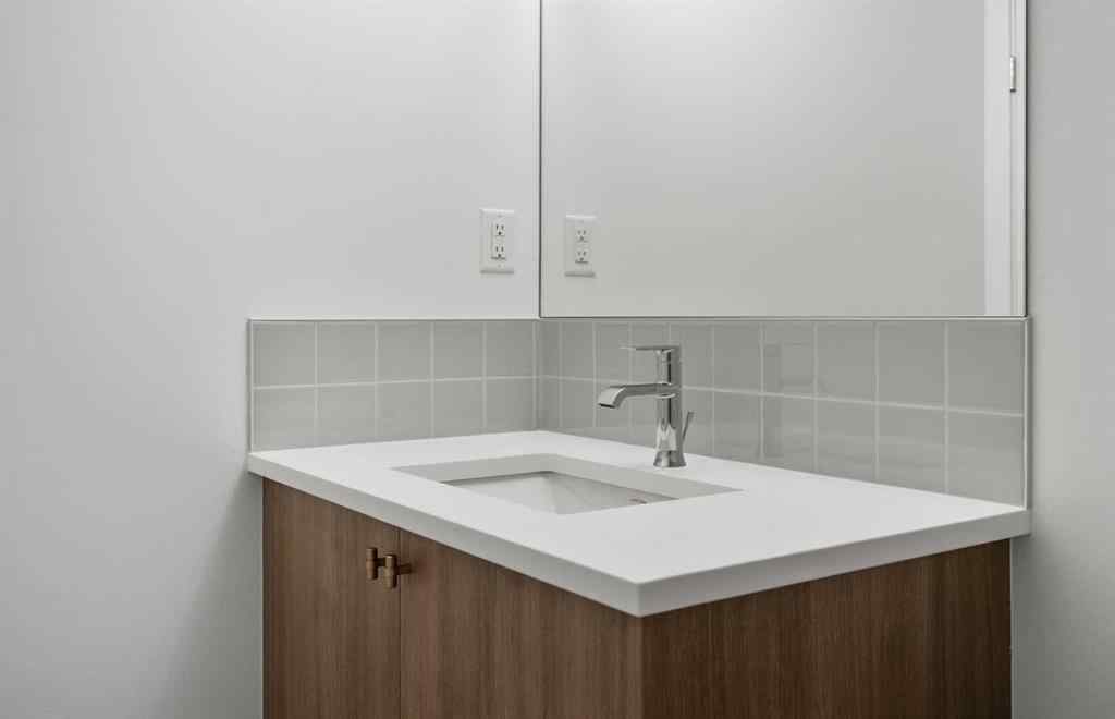 MLS® A2264976 - 8313 8 Avenue SW in West Springs Calgary, Residential