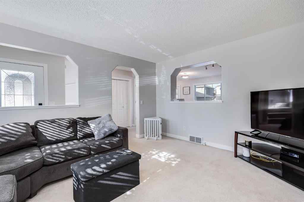 MLS® A2264979 - 212 Luxstone Place SW in Luxstone Airdrie, Residential