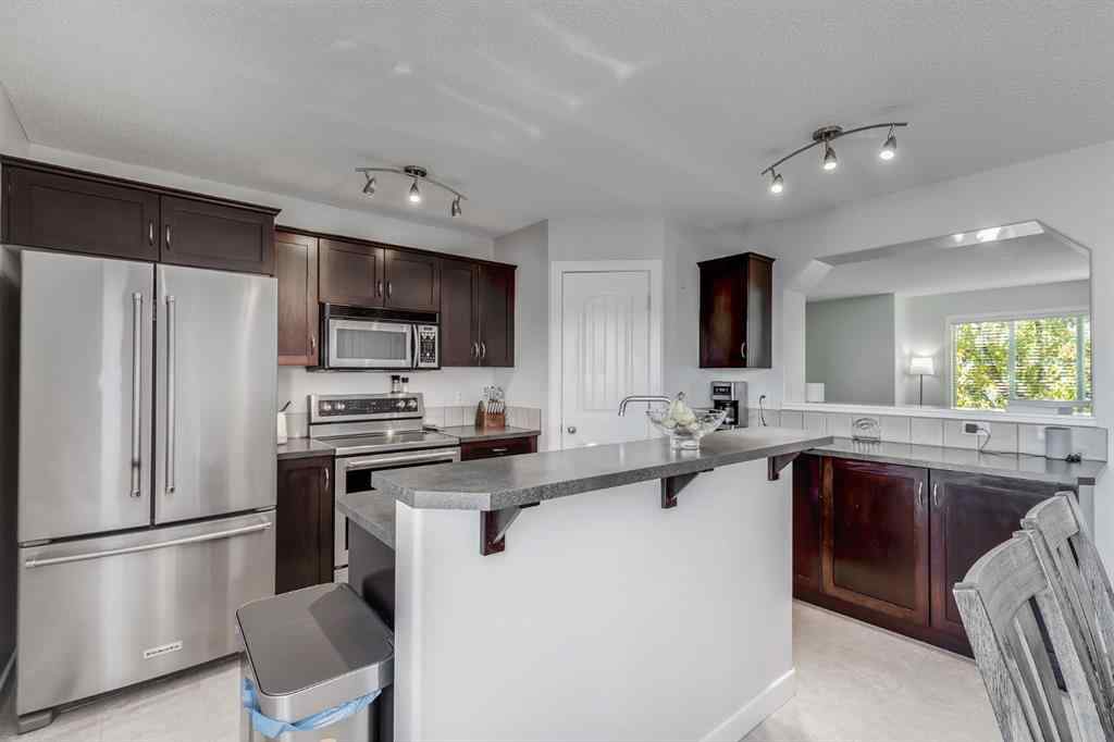 MLS® A2264979 - 212 Luxstone Place SW in Luxstone Airdrie, Residential