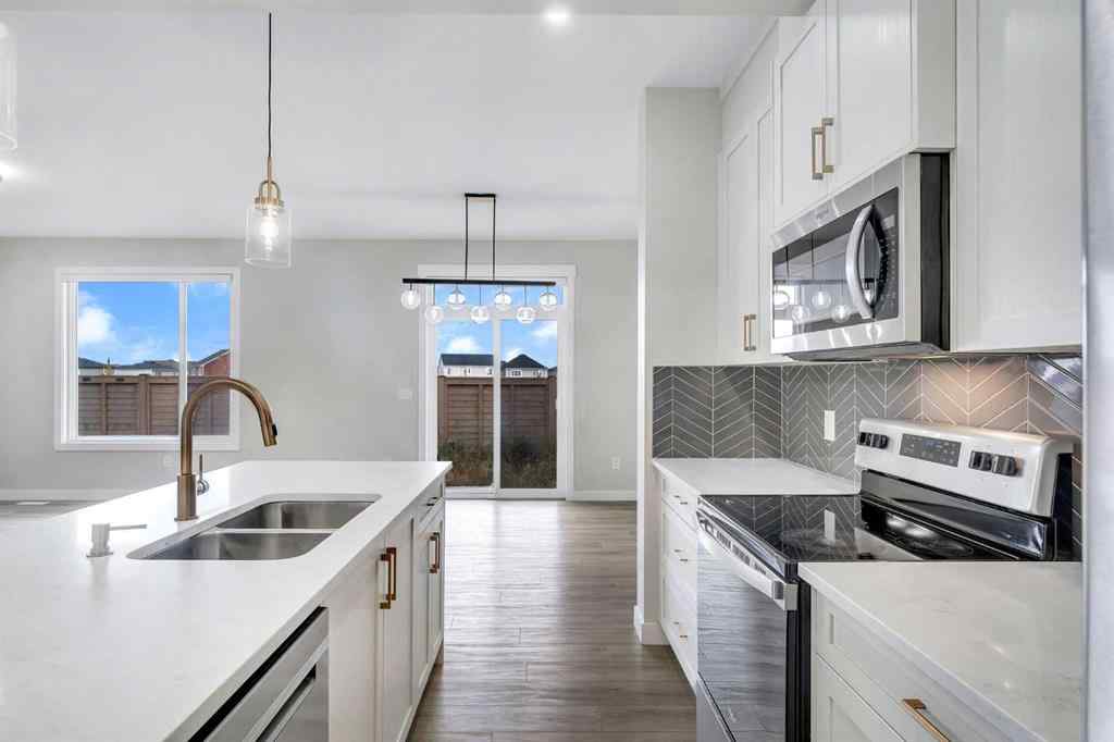 MLS® A2264996 - 592 Savanna Crescent NE in Saddle Ridge Calgary, Residential