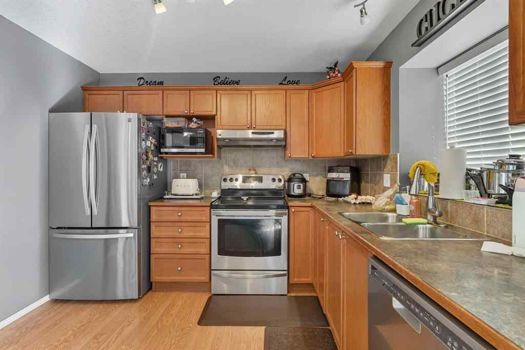 MLS® A2265001 - 824 Luxstone Square SW in Luxstone Airdrie, Residential