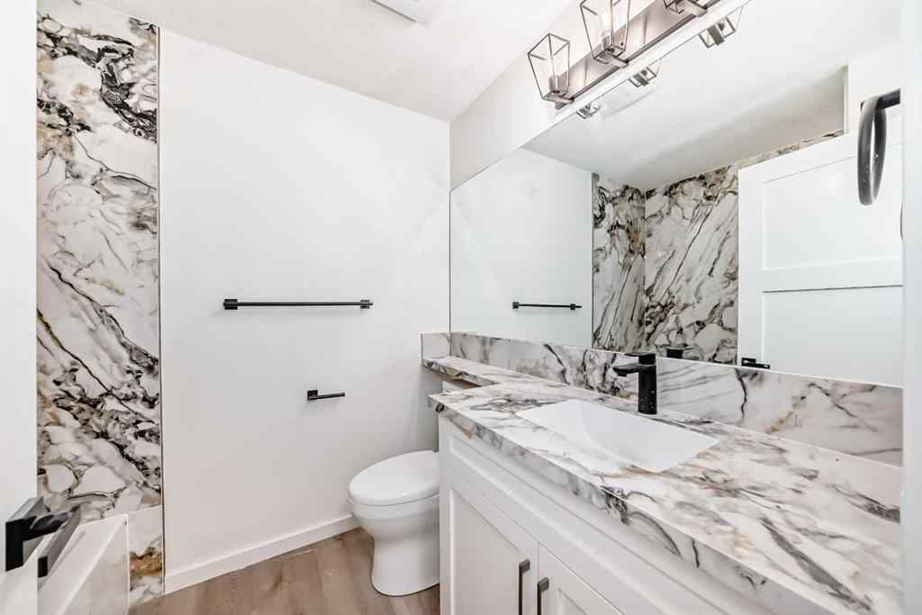 MLS® A2265054 - 64 Woodstock Road SW in Woodlands Calgary, Residential