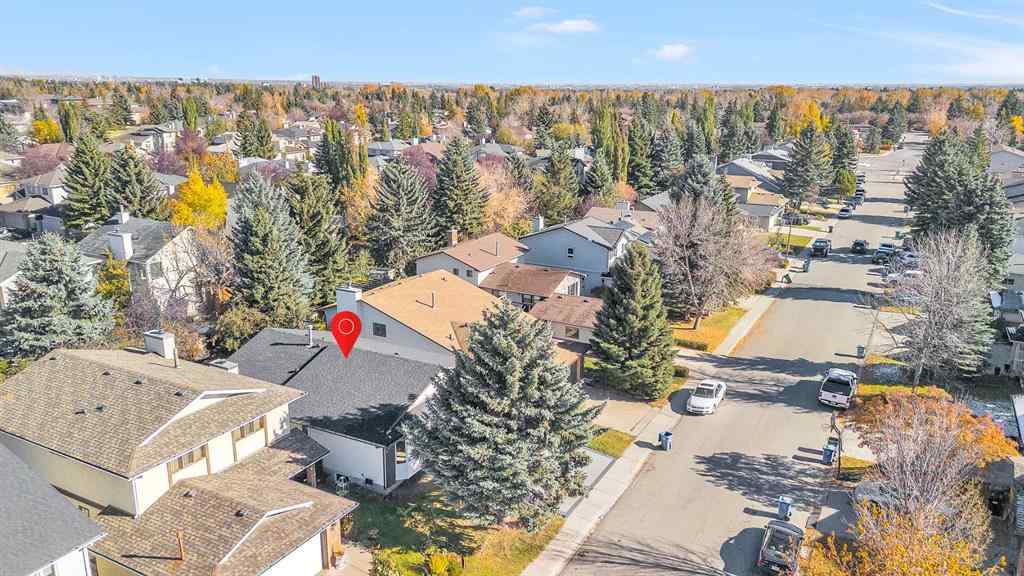 MLS® A2265054 - 64 Woodstock Road SW in Woodlands Calgary, Residential