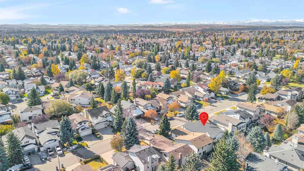 MLS® A2265054 - 64 Woodstock Road SW in Woodlands Calgary, Residential