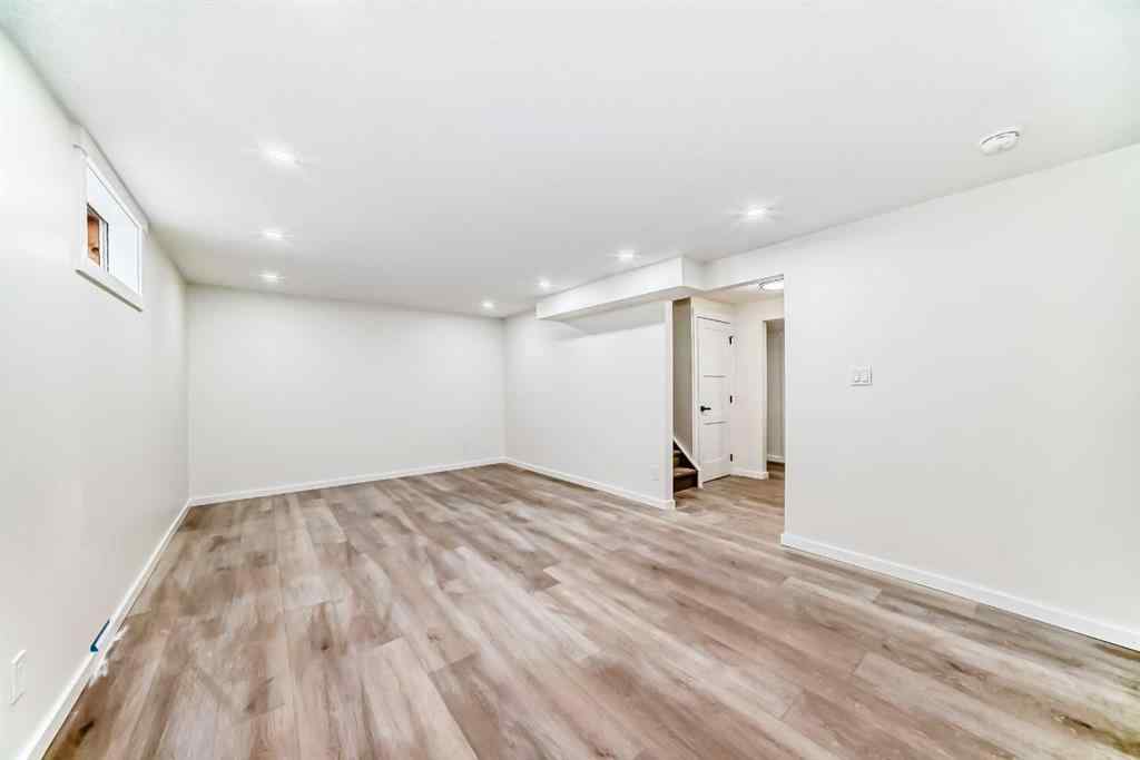 MLS® A2265054 - 64 Woodstock Road SW in Woodlands Calgary, Residential