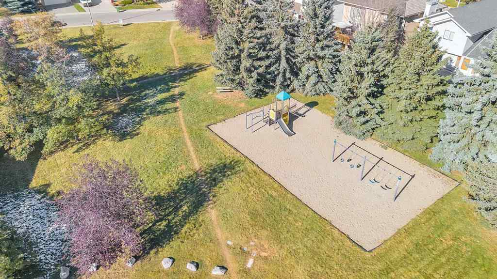 MLS® A2265054 - 64 Woodstock Road SW in Woodlands Calgary, Residential