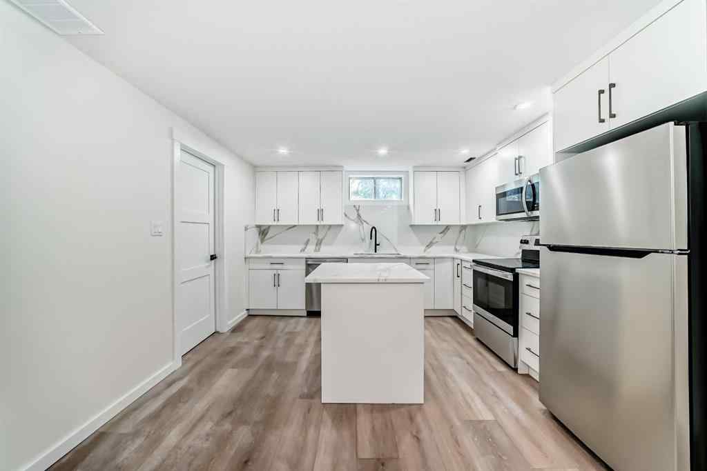 MLS® A2265054 - 64 Woodstock Road SW in Woodlands Calgary, Residential