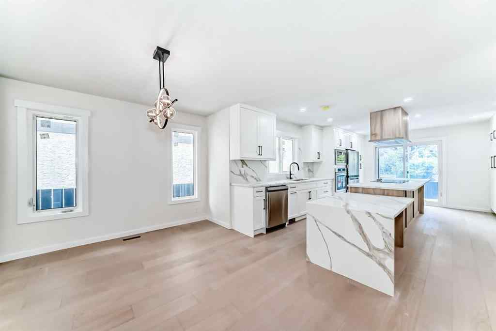 MLS® A2265054 - 64 Woodstock Road SW in Woodlands Calgary, Residential