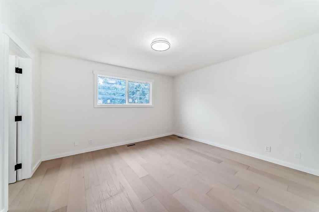 MLS® A2265054 - 64 Woodstock Road SW in Woodlands Calgary, Residential