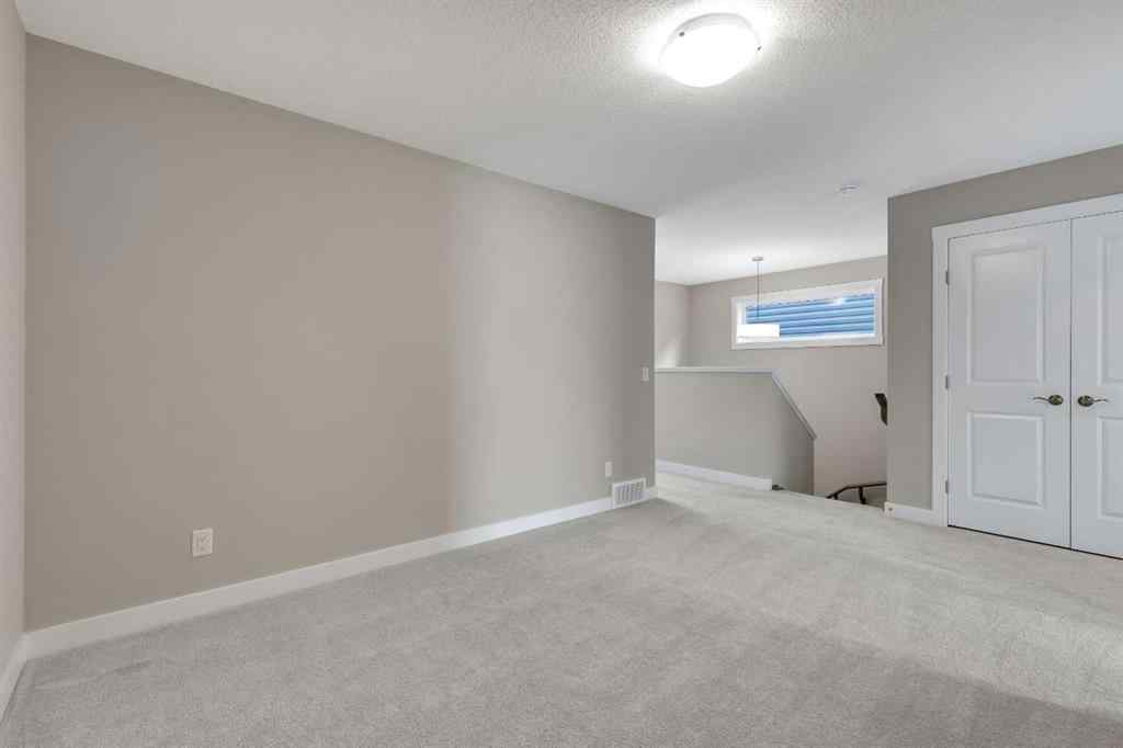 MLS® A2265104 - 216 Creekstone Row SW in Pine Creek Calgary, Residential