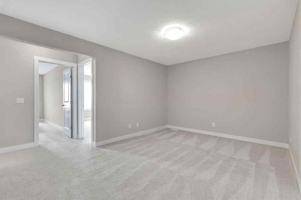MLS® A2265104 - 216 Creekstone Row SW in Pine Creek Calgary, Residential
